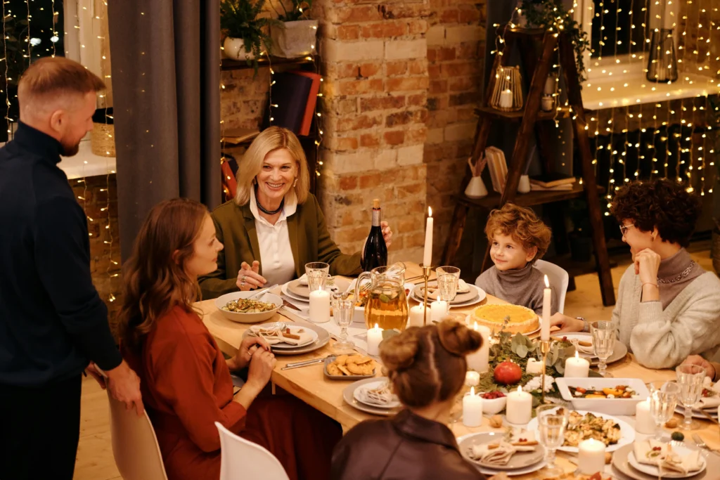 Beautiful indoor celebration showcasing New Year Home Decorations, a festive dining table, and joyful family moments.”